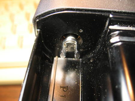Canon FTb film rewind knob from inside the film compartment.